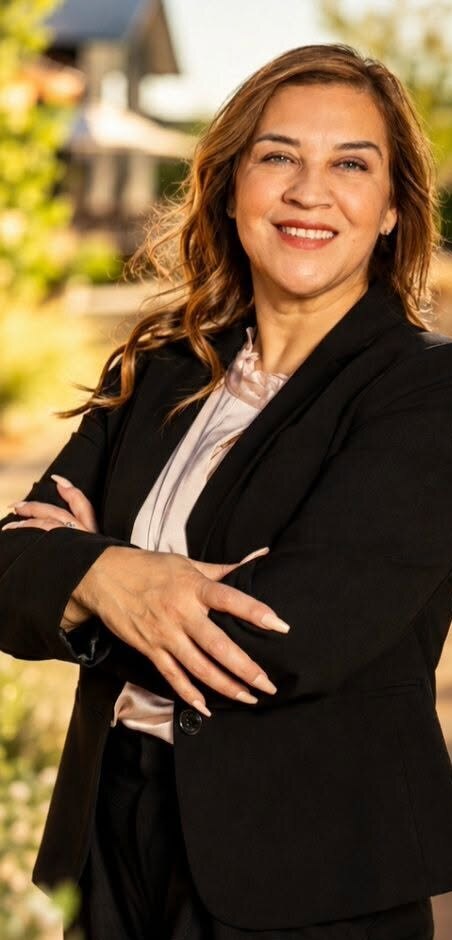 Christina Salinas Jurado, Realtor®, in a black suit